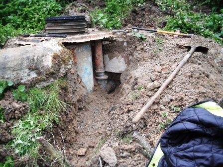 Collapsed old septic tank